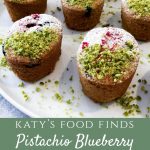 Close up of Pistachio Blueberry Friands topped with Crushed Pistachios and Icing Sugar.