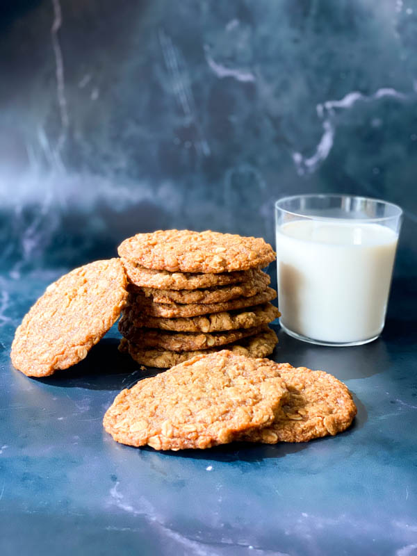 Anzac Biscuits with a glass of milk.