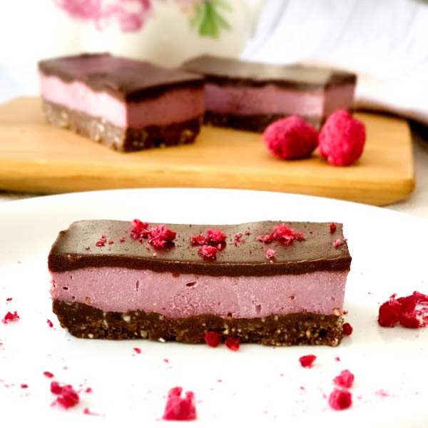 Raw Raspberry Chocolate Slice sprinkled with Freeze-Dried Rasoberries.