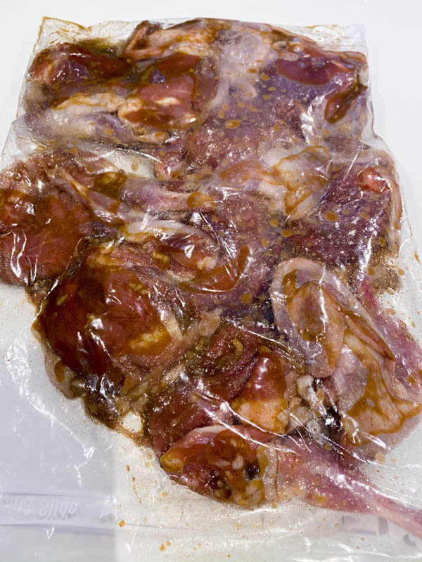 The butterflied Quail in a glad bag with all the marinade ingredients.