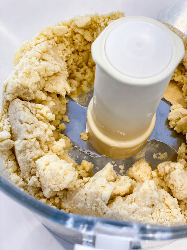 The shortcrust pastry base made in the bowl of a food processor.