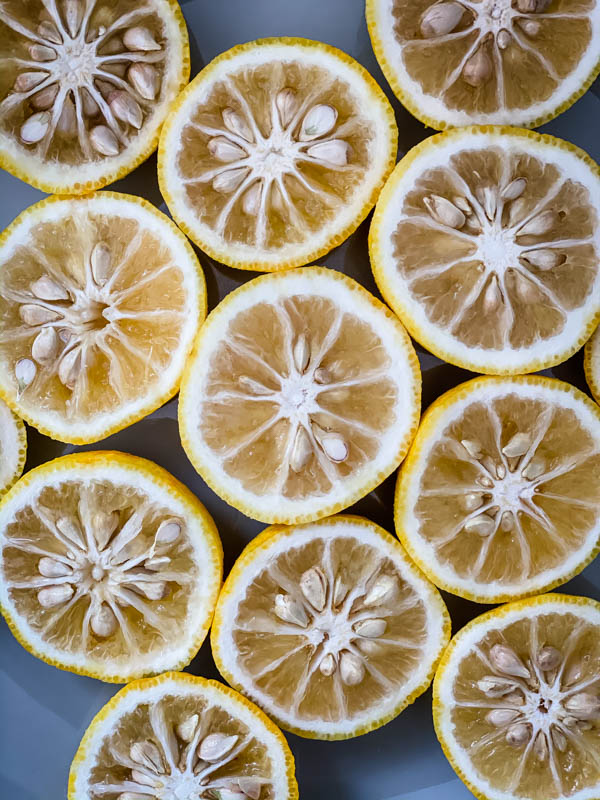 Yuzu fruit cut in half showing the insides of the fruit.