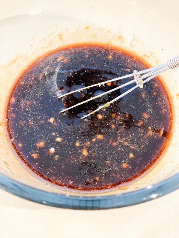 The pomegranate marinade in a glass bowl ready to be put on the Quail.