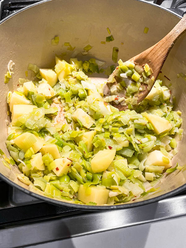 The sauteed leek and potato mixture in the pot are now ready for stock to be added.