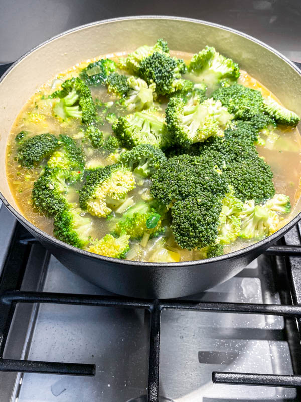 The broccoli florets are now added to the soup.