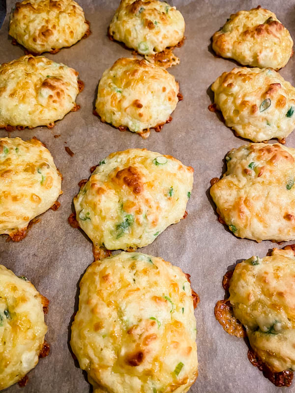 The baked Cheese Puffs are resting on the baking tray.