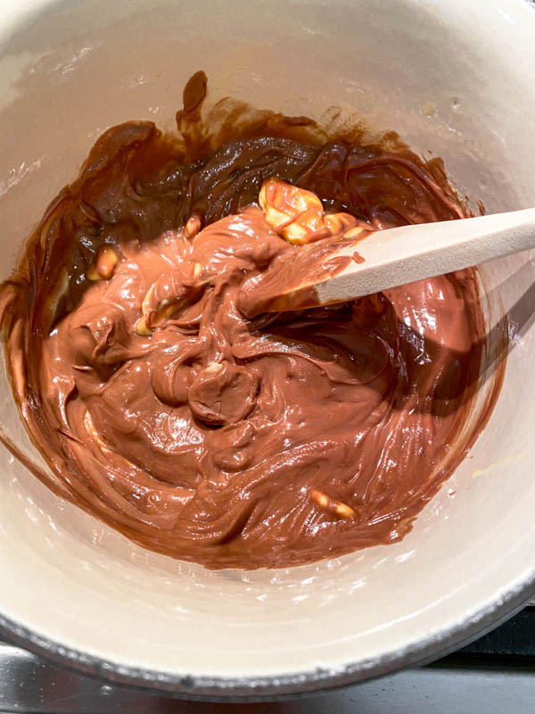 The pot of chocolate and butter being melted over low heat for the topping.
