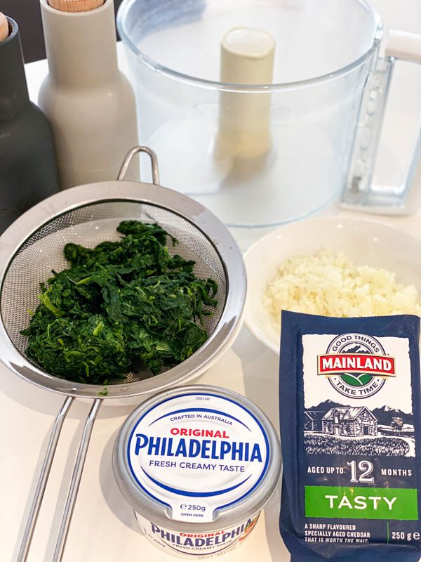 All the ingredients for the Spinach Dip are all on a kitchen bench.