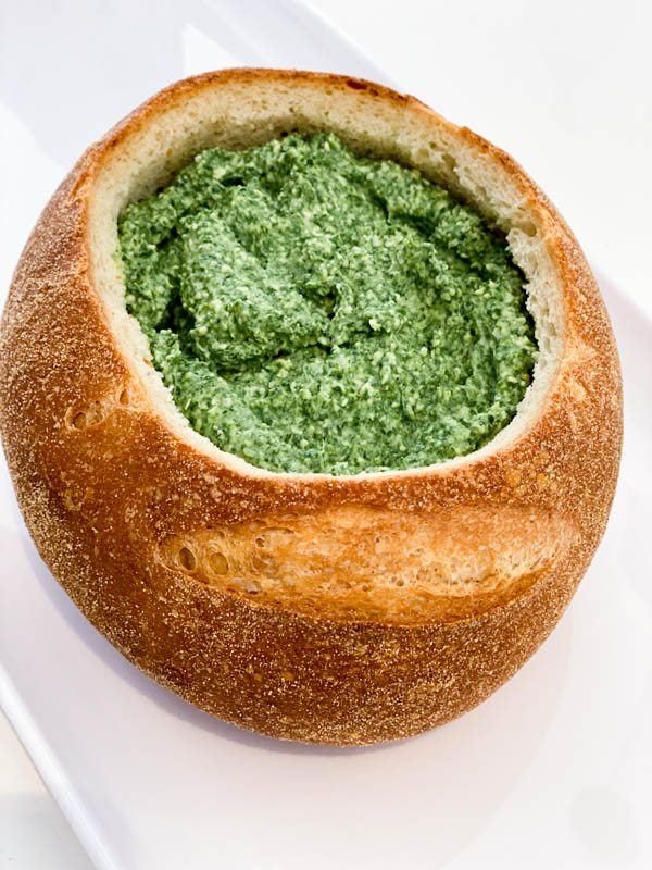 The Spinach Dip is now inside the cob loaf and it's now ready for the bread lid to be replaced for cooking in the oven.