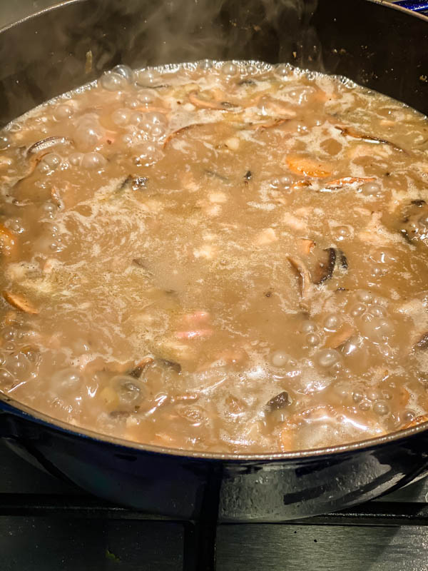 The chicken stock has now been added to the mushroom mix and is bubbling away to reduce a little before the chicken is added back to the pan.