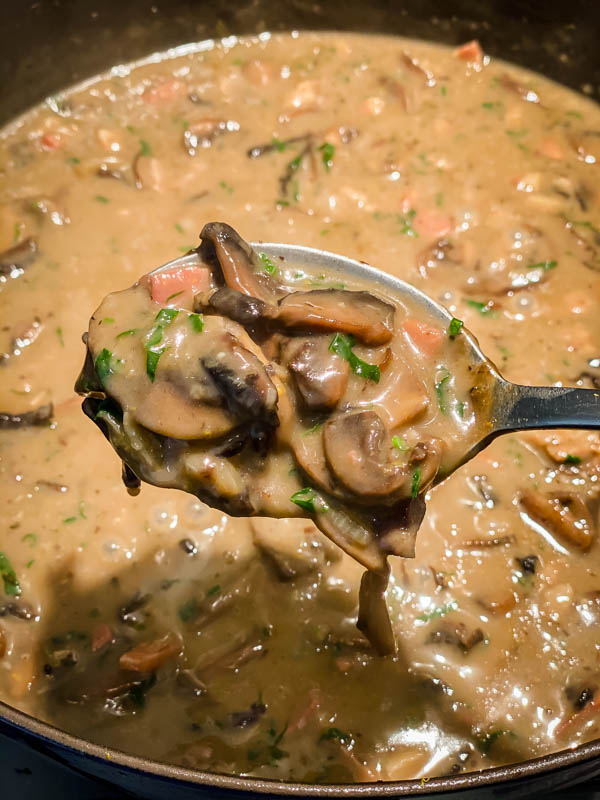 The sauce has now been cooked in the oven with the chicken. The chicken is now removed and the photo shows how the sauce has thickened. This will now be reduced a little more on the stovetop and cream added.