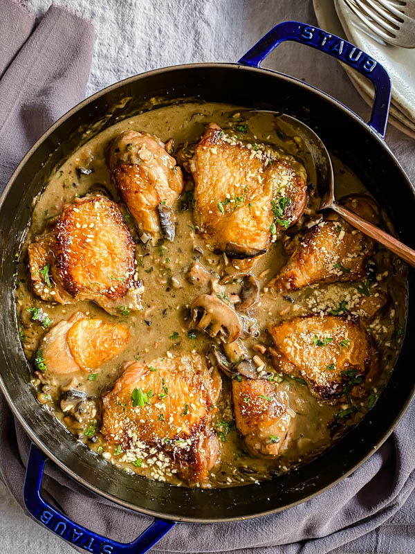 Looking down into the Chicken bake that is on a dining table dressed with a grey tablecloth.