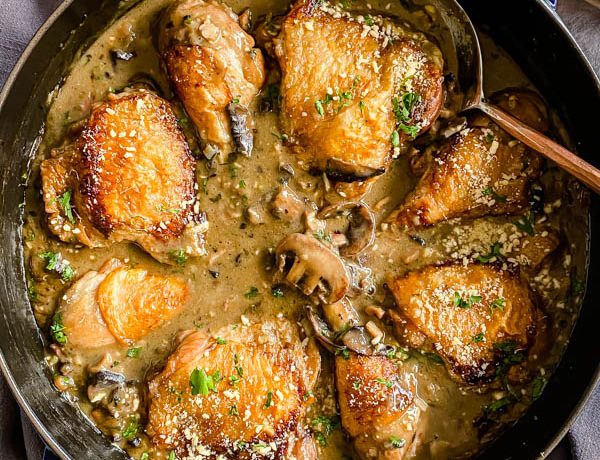 Close up of the Chicken Bake showing parsley and parmesan cheese sprinkled over the bake to garnish.