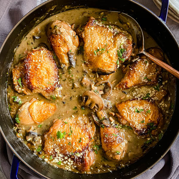 Close up of the Chicken Bake showing parsley and parmesan cheese sprinkled over the bake to garnish.