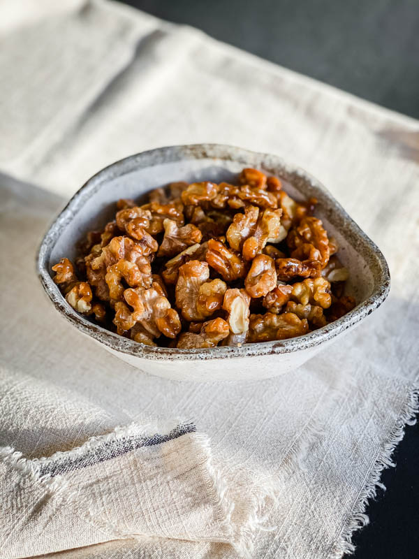 A bowl of ready to eat Candied Walnuts.