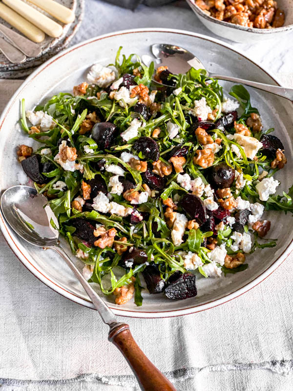 A large round platter with the salad on it.