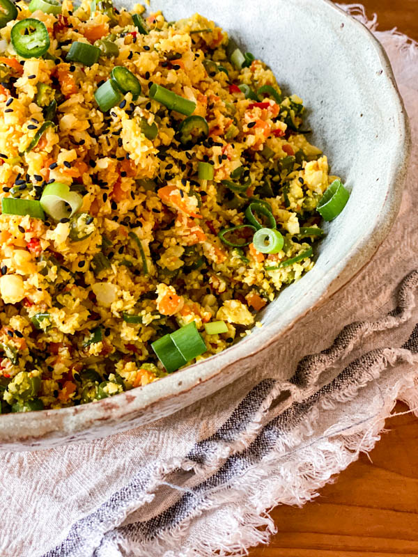 A close up of the Cauliflower Fried Rice in a serving bowl.