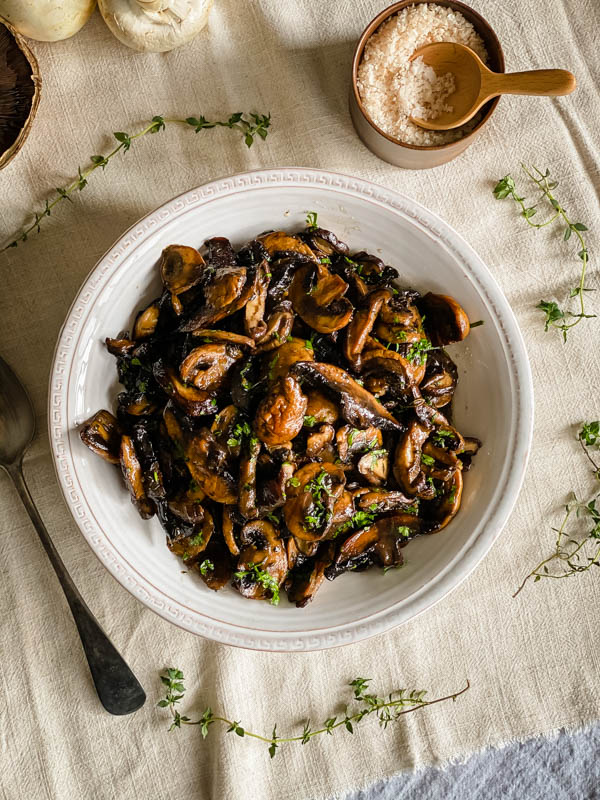 Looking down on the bowl of roasted mushrooms.