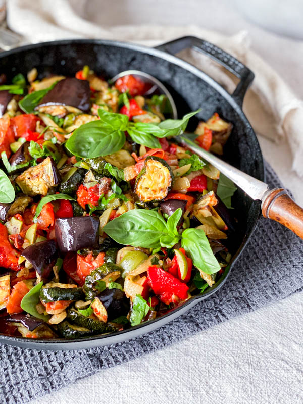 The pan of Roasted Ratatouille Salad with a serving spoon.