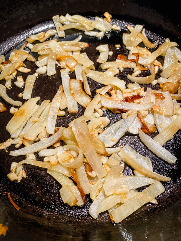 The onions and garlic that have been cooked and softened.