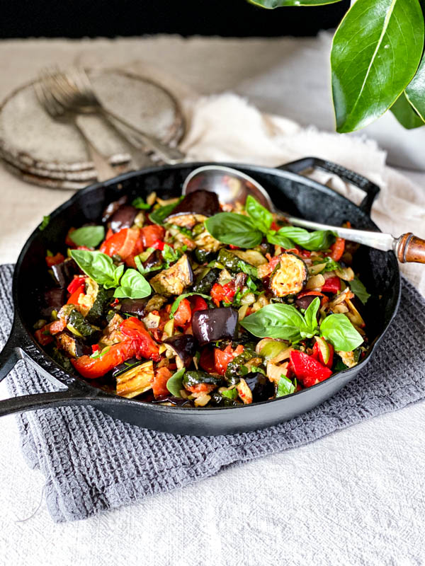 The Roasted Ratatouille Salad is in a pan on the table.