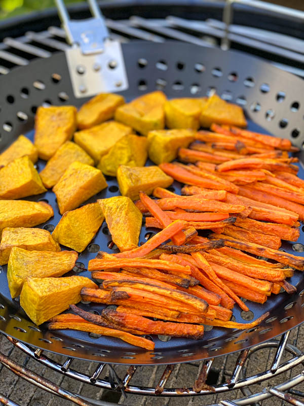 This shows the now roasted carrot and pumpkin pieces that are nicely cooked and slightly caramelised at the edges.