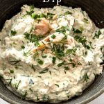 The Smoked Salmon Dip is ready to be served and is garnished with some extra chopped chives and dill as well as some extra flaked smoked salmon.