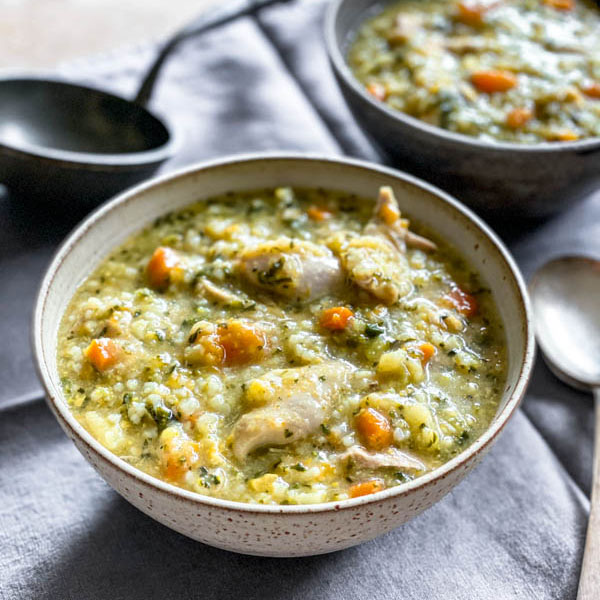 The soup is in bowls on a table ready to be served.