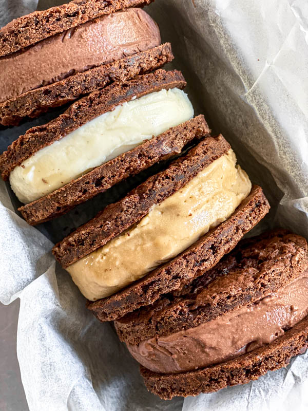 The cookies are made into ice-cream sandwiches which are pictured here on their side in a baking tin.