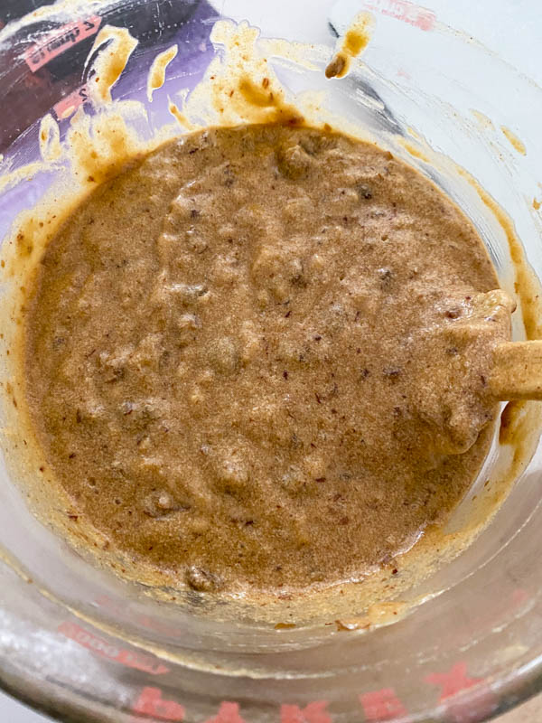 The cake batter now has the dates added and is in a bowl ready to be poured into the baking tin.