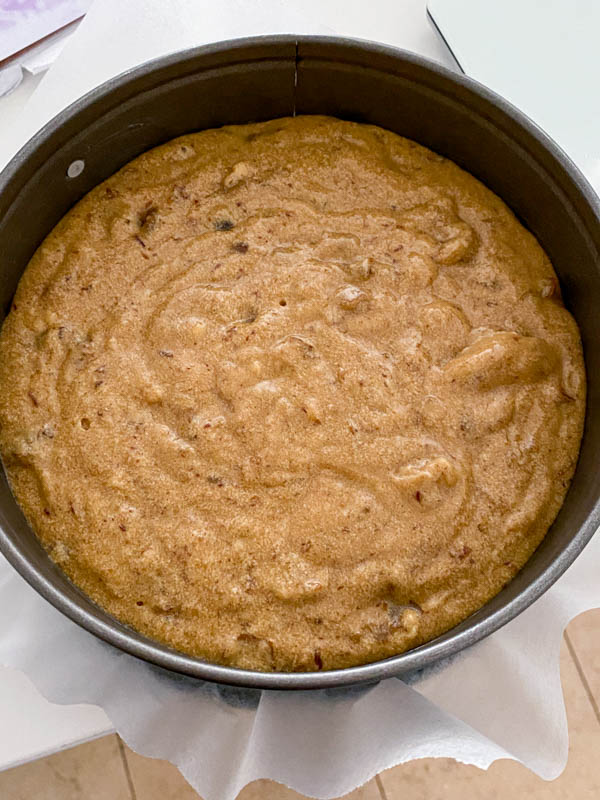 Looking down into the baking tin with the cake batter inside, ready to be put in the oven.