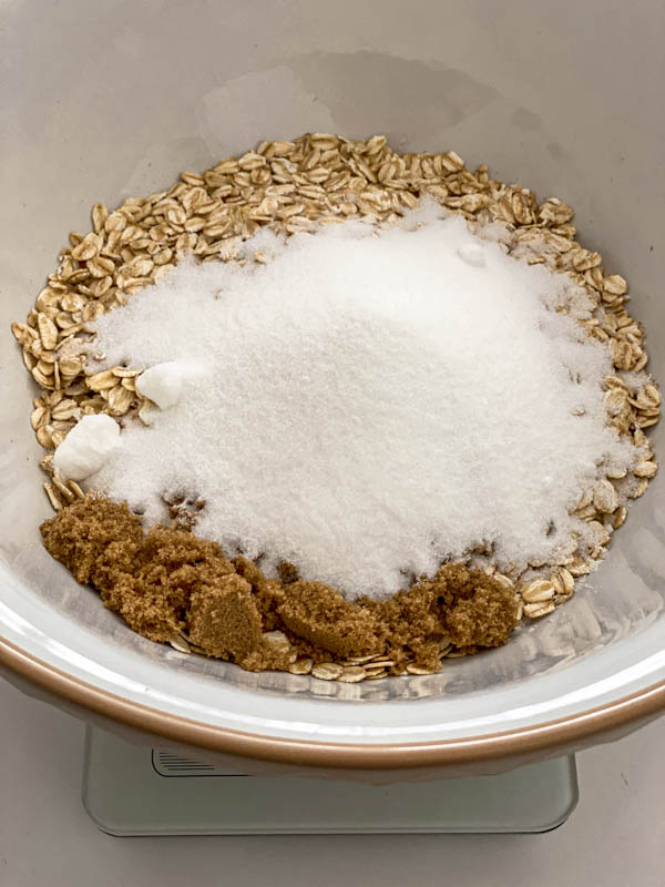 All the dry ingredients for the Anzac Biscuit recipe are in a bowl.