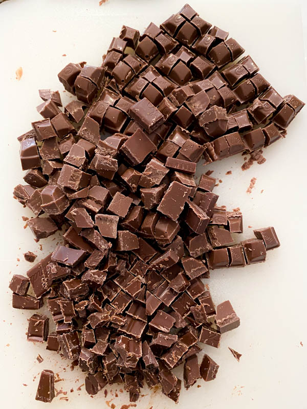 Looking down onto the chopped chocolate chunks which have been cut into 1cm pieces.