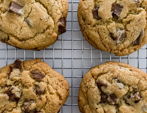 Looking down onto the golden chocolate chip cookies that are loaded with chocolate chunks.