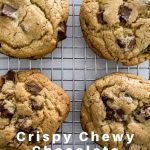 The Crispy Chewy Chocolate Chip Cookies are ready after resting. They are golden and photographed on a resting rack.