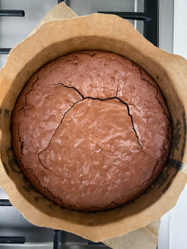 Looking down onto the baked brownie that is now resting in the baking tin until completely cooled down.