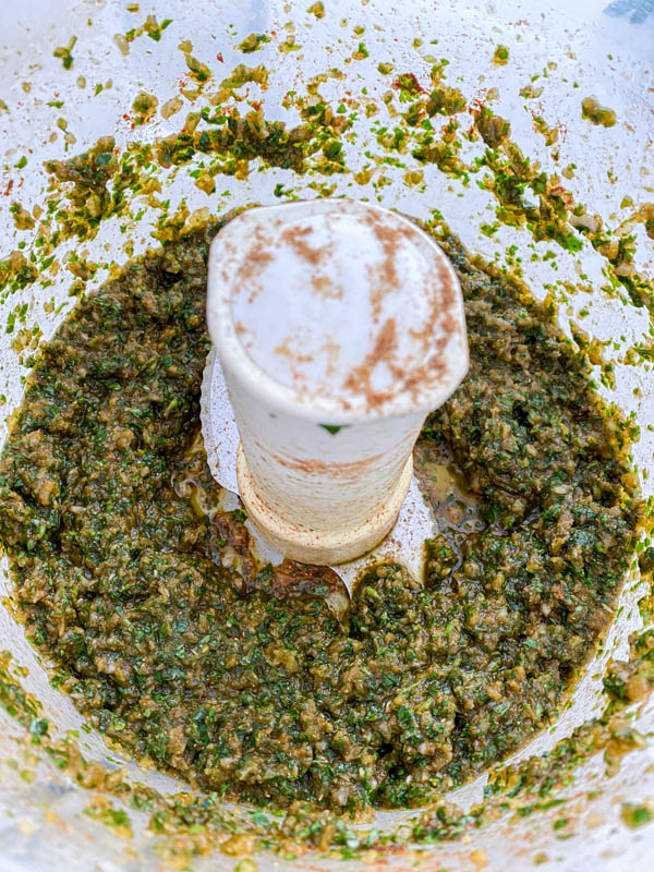 The herbs, spices and seasonings are all blended together to form a paste.