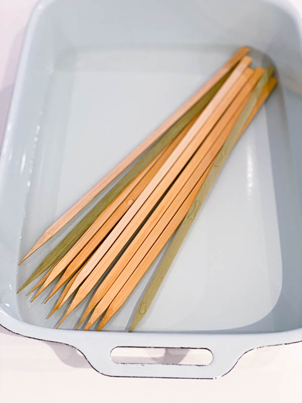 The bamboo skewers are soaking in water before being used.