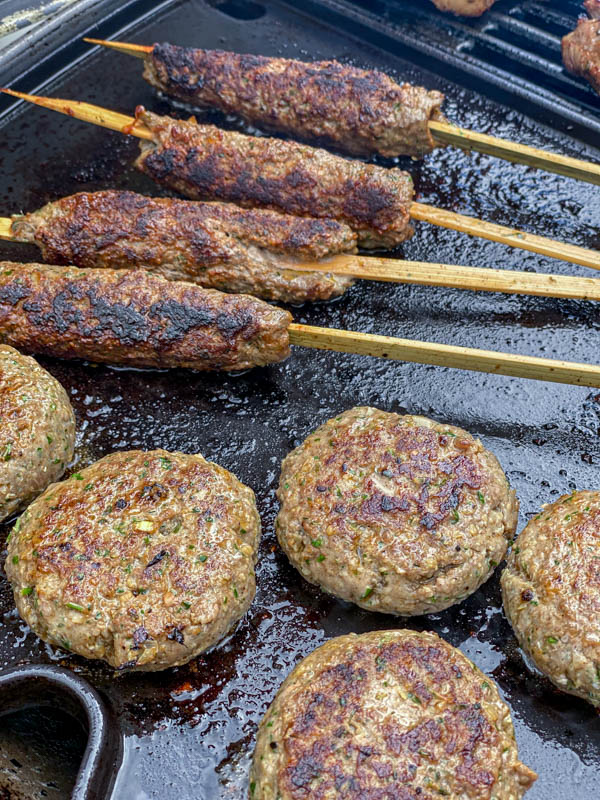 The kofta skewers and patties are nice and charred from cooking on a barbeque plate.