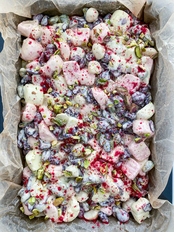 The mixture is now poured into the lined baking tin and spread out, ready to be refrigerated.