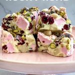 The pieces of White Chocolate Rocky Road are placed on a pink cake stand ready to be served.