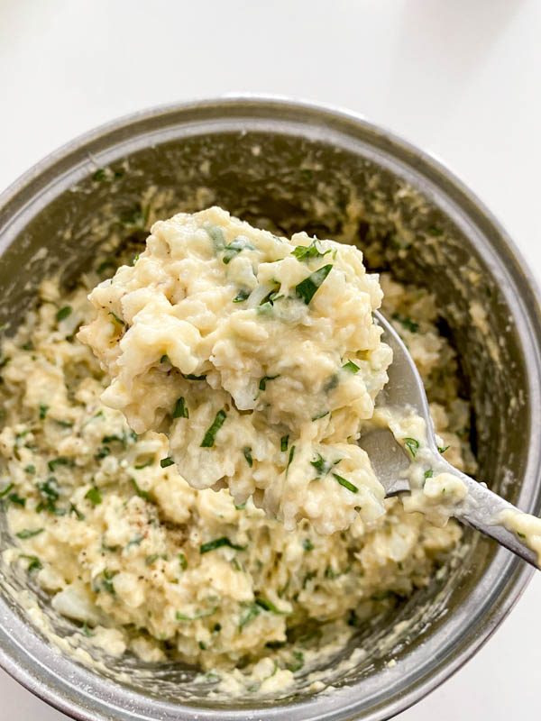 A spoonful of batter is shown here so you can see the thick consistency which holds on the spoon.