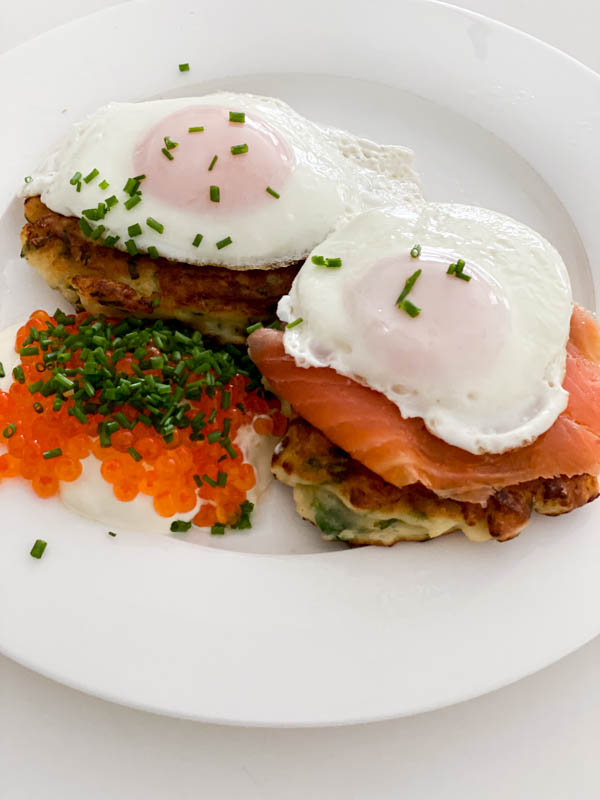 Here the Cauliflower Fritters are larger and there are 2 on a plate topped with smoked salmon and fried eggs. Alongside is sour cream and salmon roe. A great breakfast dish.