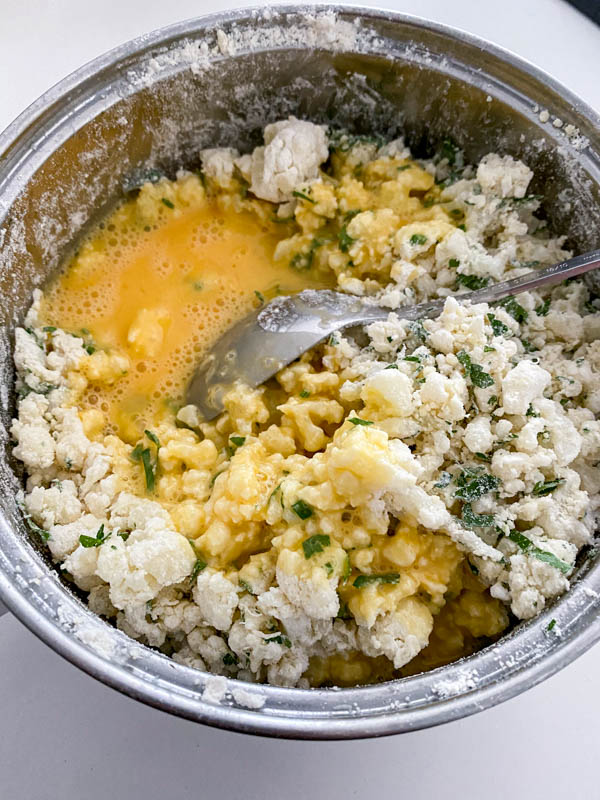 The lightly beaten eggs are now added to the mixture in the pot.
