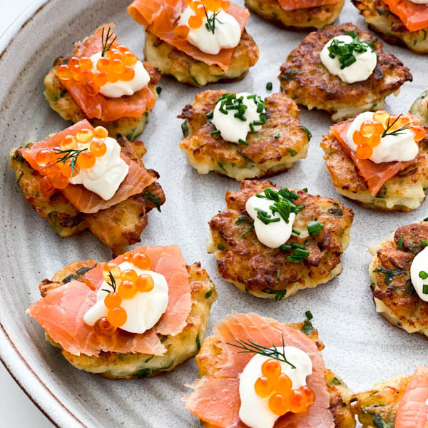 A close up of the fritters with toppings ready to be served.