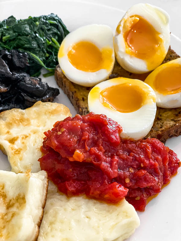 Some breakfast tomatoes served as part of a cooked breakfast.