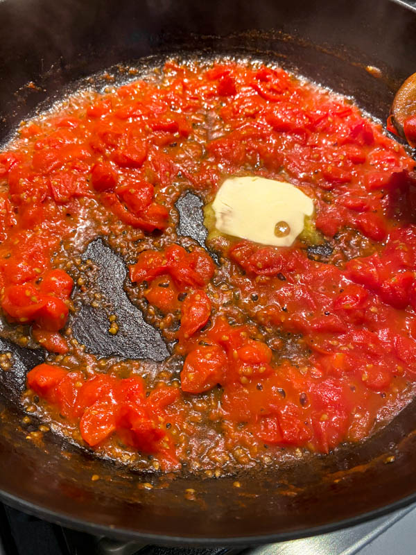 A small knob of butter is added to the sauce at the last minute. This step is optional.