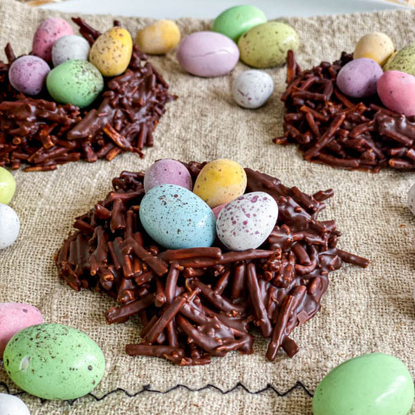 A close up of the Easter Chocolate Nests filled with colourful mini easter eggs.