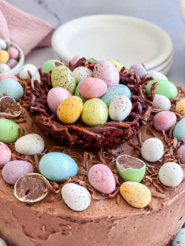 A close up of the chocolate nest filled with mini easter eggs which is the centrepiece of the cake.