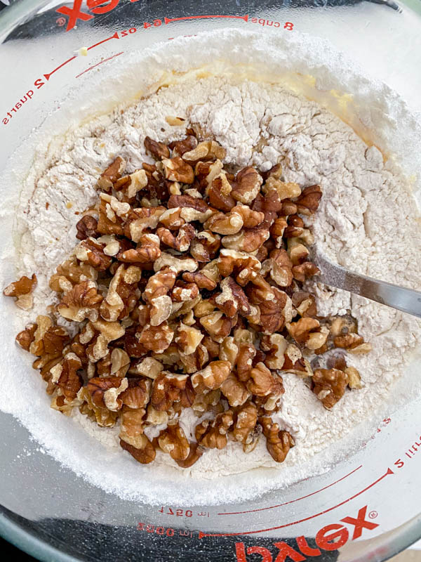 The flour and walnuts are added to the date mixture.